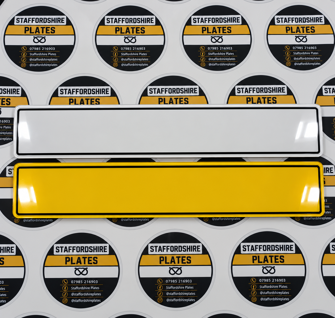 White and yellow number plates with a black border