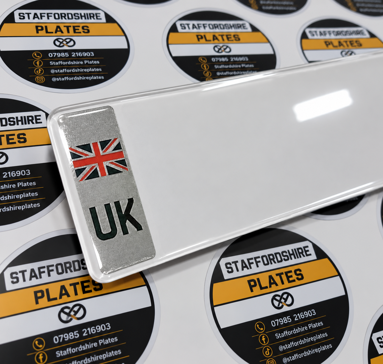 UK badge plate with a Union Jack and UK lettering