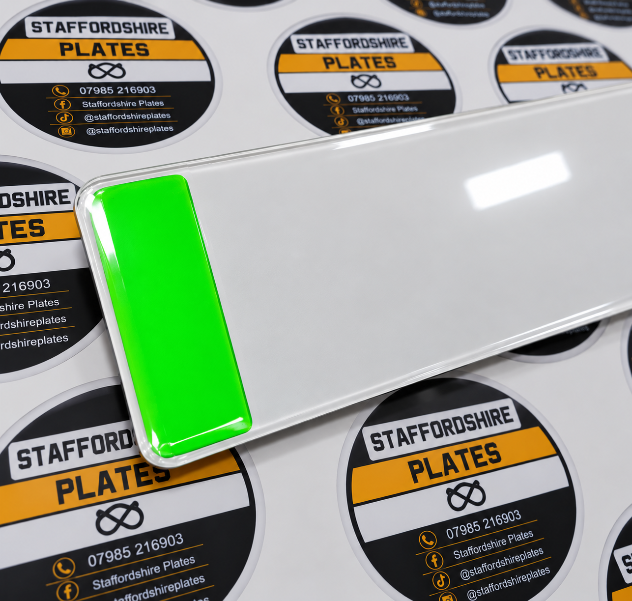 Vehicle plate with a bright green EV panel