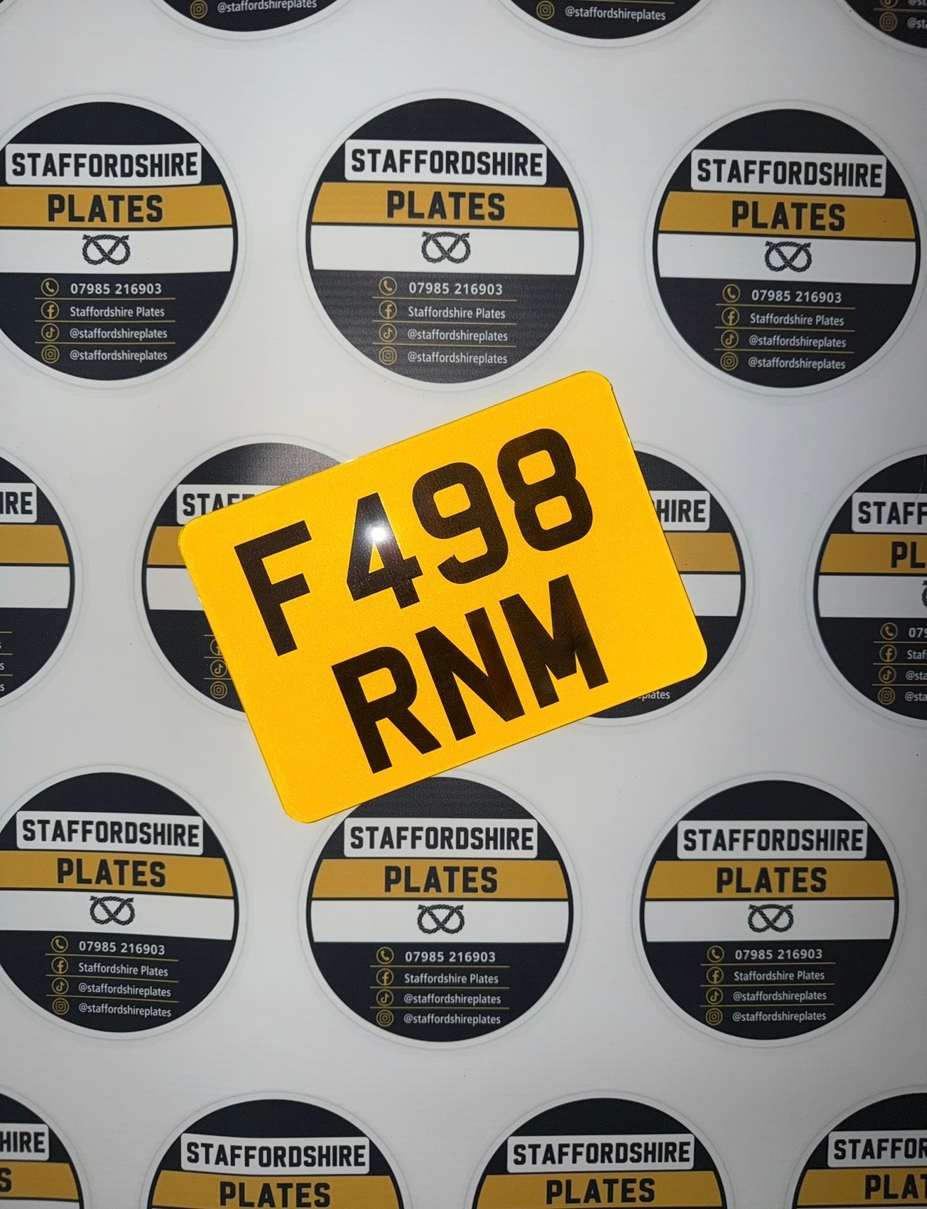 Yellow F498 RNM custom number plate